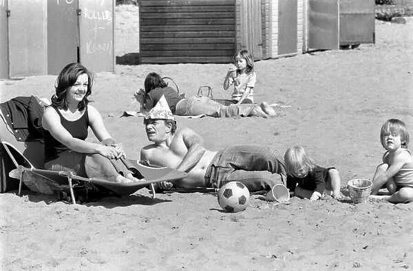 A family enjoying the hot weather at Margate Beach. April 1975 75-2073-005