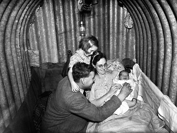 Family inside Air Raid Shelter during WW2