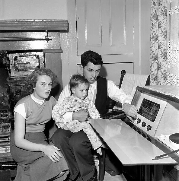Family life: Mr. and Mrs. Hull with their son. 1954 A160-009