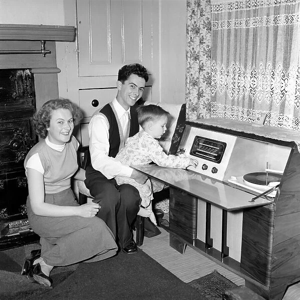 Family life: Mr. and Mrs. Hull with their son. 1954 A160-010