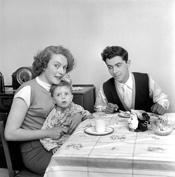 Family life: Mr. and Mrs. Hull with their son having tea. 1954 A160-006