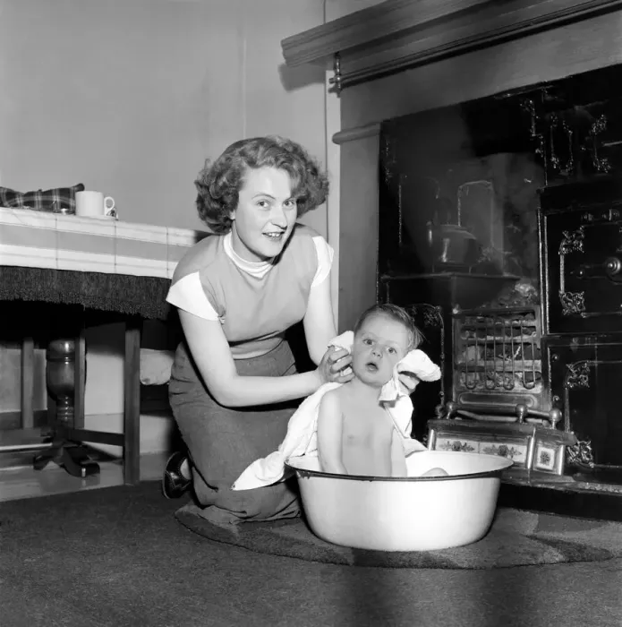 Framed Print : Family life: Mrs. Hull seen here bathing her son before giving him tea. 1954 A160-003