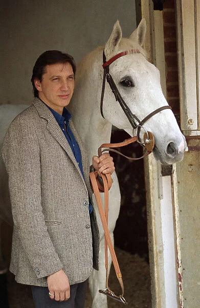 Famous racehorse Desert Orchid in his stables with owner Richard Burridge