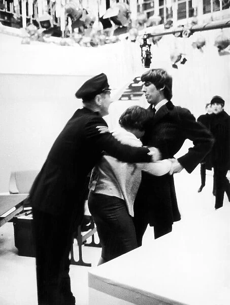 Fan accosts George Harrison of The Beatles at Teddington TV Studios
