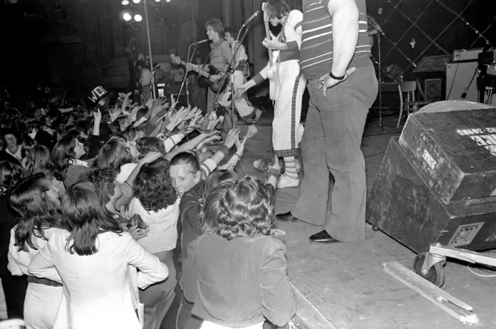 Framed Print : Fans cheer as the Bay City Rollers perform on stage at Cardiff. May 1975