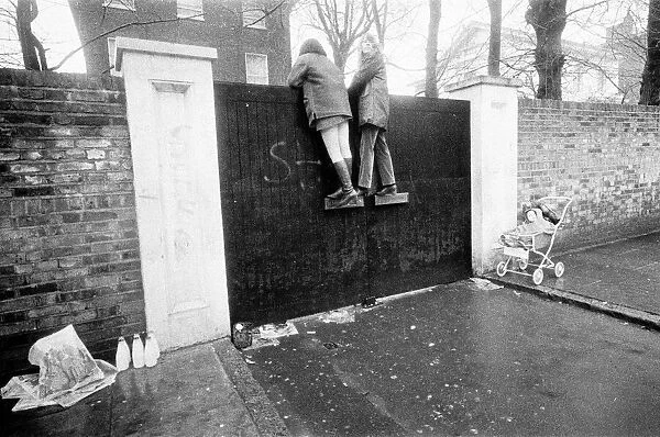 Fans climb up Paul McCartneys front gates of his St Johns Wood