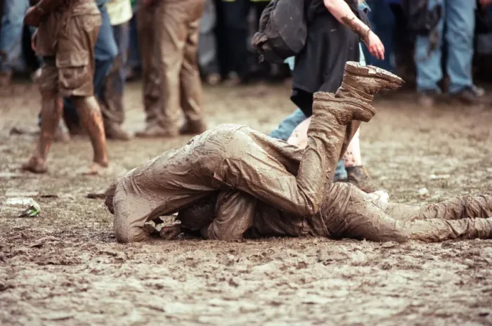 Framed Print : Fans covered in mud, at Margam Park to watch Catatonia performing, South Wales