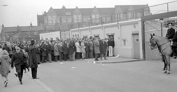 Fans queue up outisde The Den, home of Millwall football club