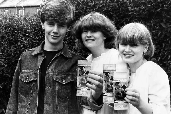 Fans of Singer David Bowie, proudly show off their tickets for his upcoming Murrayfield