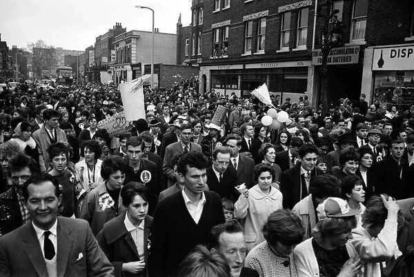 Fans of Tottenham Hotspur celebrate in the streets of North London after winning the FA