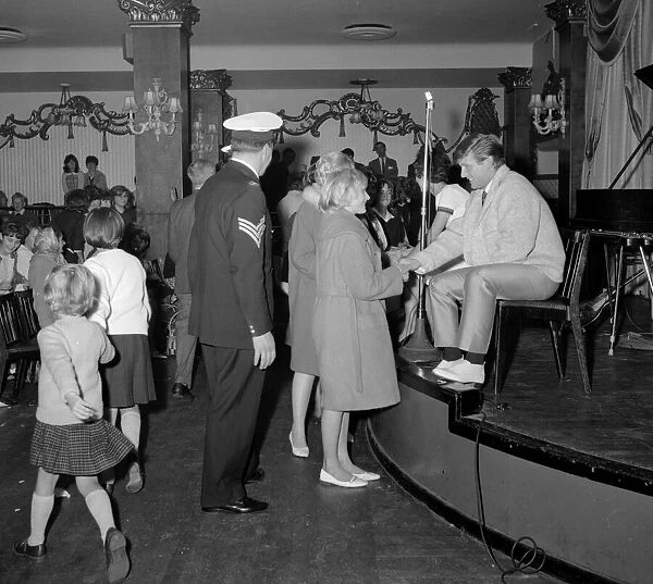 Fans welcome the return of pop singer Johnny Leyton at a fan club concert at the Empire