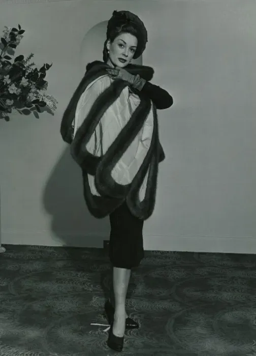 Framed Print : Fashion 1950s Model wearing a wild mink stole on pleated taffeta with matching gloves