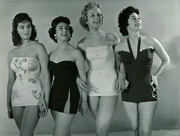 Fashion 1950s Four models wearing swimwear  /  swimming costumes in a corset style