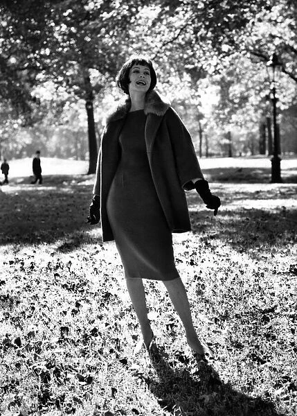 Fashion 1960s. Thats why the lady is a vamp! Ankle-deep among the falling leaves of