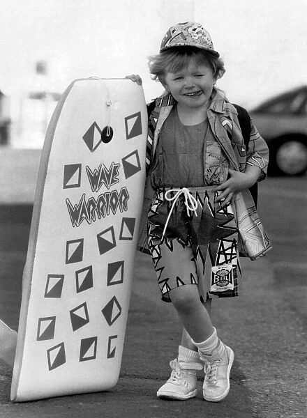 Fashion - Beachwear: Whizkid on the board. Shes barely bigger then the board