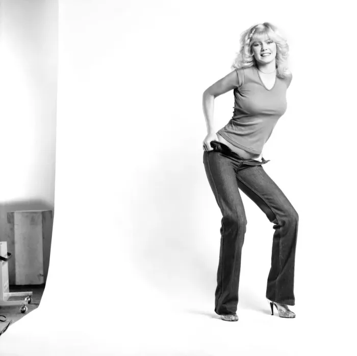 Framed Print : Fashion: Clothing: A woman pulling up a pair of denim jeans. January 1981 81-00051-001 Framed Print : Fashion: Clothing: A woman pulling up a pair of denim jeans. January 1981 81-00051-001