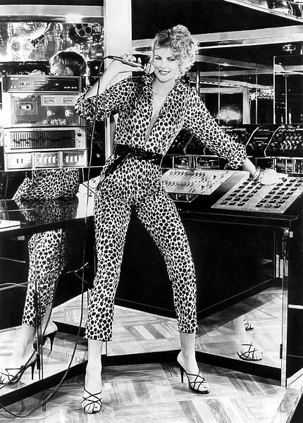 Fashion - Misc. Model in recording studio with microphone. Leopard print