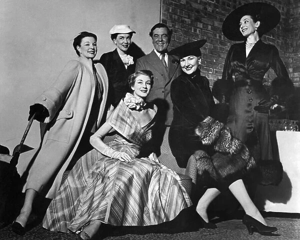 Fashion. Norman Hartnell with his models - dolores, Jane Thelma, Lana and Shiela