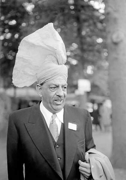 Fashion at Royal Ascot - June 1953 a man wearing a turban style hat