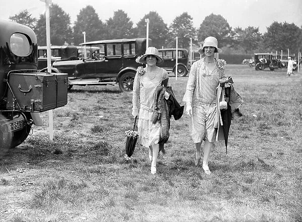 Fashion at Royal Ascot - Ladies Day - a woman shows off her style of dress and hat