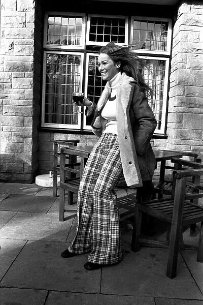 A fashion shoot from 26 October 1971 A model wearing a winter coat