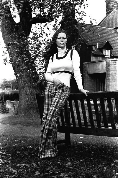 A fashion shoot from 26 October 1971 A model wearing tartan trousers