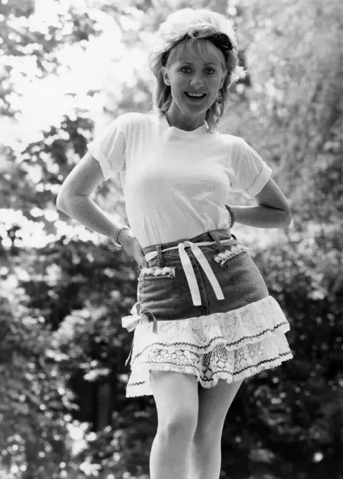 Framed Print : Fashion Skirt: Frilly Lulu in her t-shirt, hat and Acrobat rara skirt costing £32 Framed Print : Fashion Skirt: Frilly Lulu in her t-shirt, hat and Acrobat rara skirt costing £32