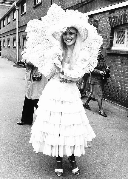 Fashionable racegoer with parasol at Royal Ascot in 1981