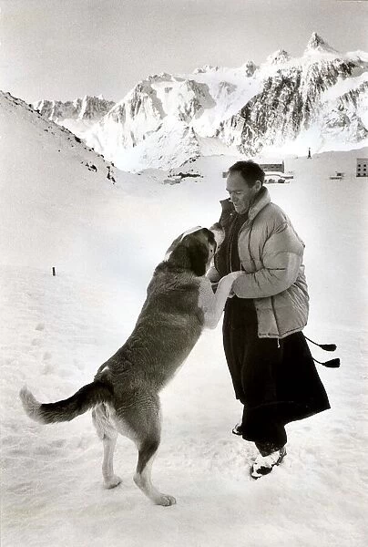 Father Bernard with Seine the St Bernand dog at St. Bernard Pass in Switzerland