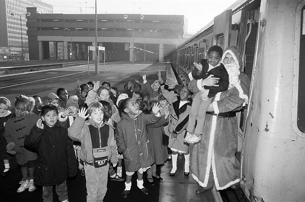 Father Christmas arriving at Snow Hill station yesterday being greeted by enthusiastic