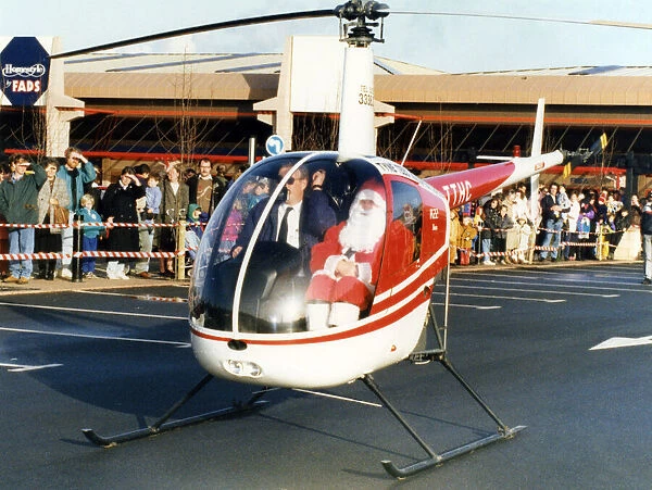 Father Christmas arriving in style, in a helicopter at the car park of Homestyle by FADS