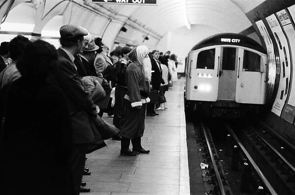 Father Christmas, of Bentalls Store, Ealing, takes the tube to pick up his sleigh