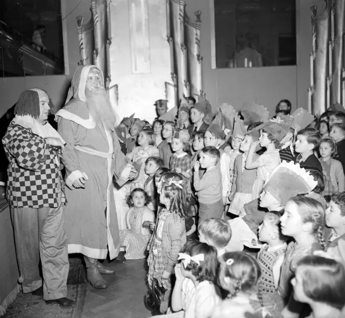 Framed Print : Father Christmas and his clown sidekick address the children at the yearly Daily Mirror Framed Print : Father Christmas and his clown sidekick address the children at the yearly Daily Mirror