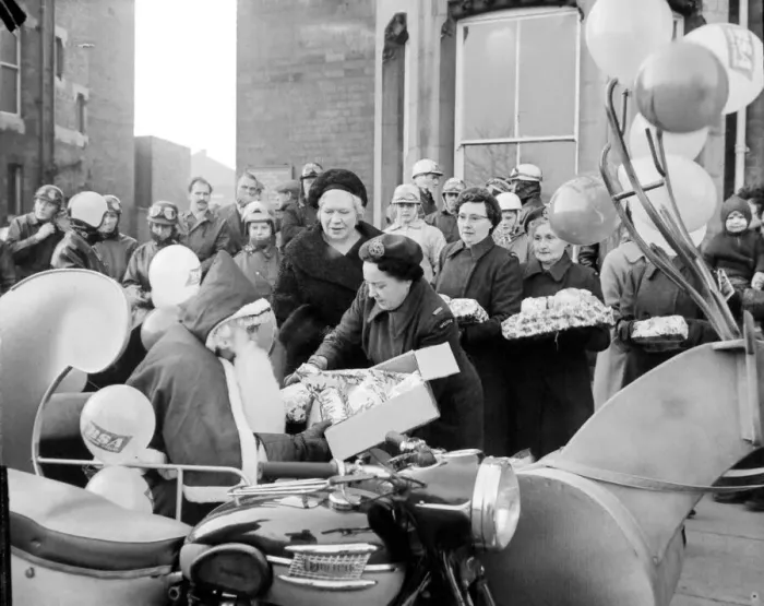 Framed Print : Father Christmas delivers presents to children at Manor House Childrens Home, Coventry Framed Print : Father Christmas delivers presents to children at Manor House Childrens Home, Coventry