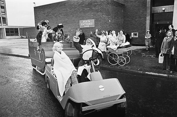 Father Christmas with kids on sleigh, Middlesbrough. Circa 195