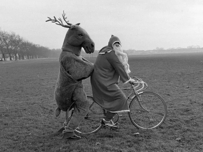 Framed Print : Father Christmas and his Rudolf the Reindeer - bike stunt A©Mirrorpix circa 1980