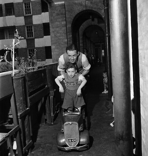 Father playing with his young son in Westminster, London. September 1950 O25749-001