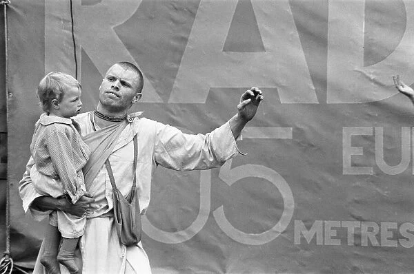 Father and son from the Indian Radha Krishna temple at the start of the Hollywood Music