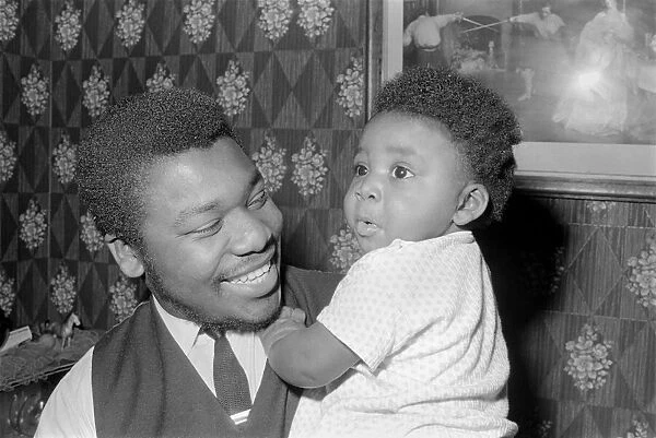 Father with his toddler son. December 1969 Z11609-002