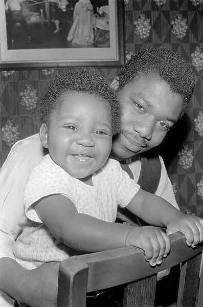 Father with his toddler son. December 1969 Z11609-003