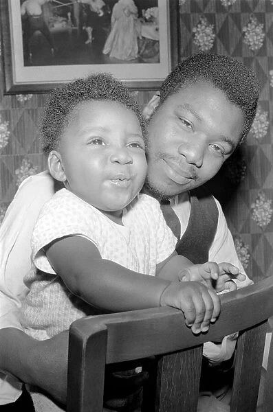 Father with his toddler son. December 1969 Z11609-004