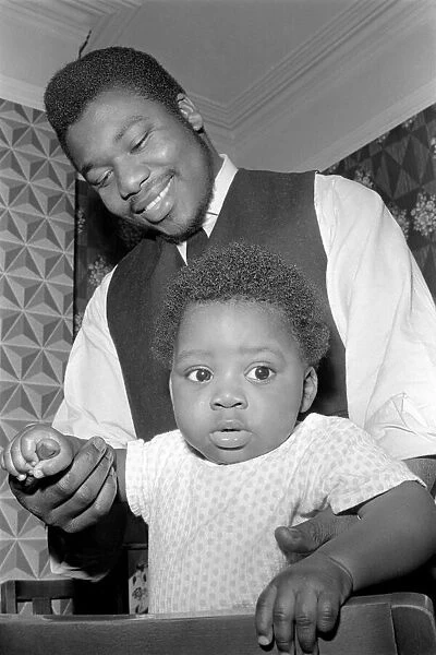 Father with his toddler son. December 1969 Z11609-006