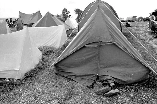 Feet sticking out of a tent at the Isle of Wight Pop Festival 30th August 1969