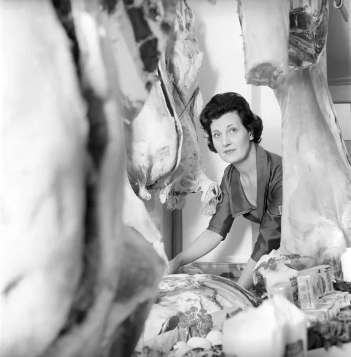 Framed Print : A female butcher seen here at work in her shop. 1963 Framed Print : A female butcher seen here at work in her shop. 1963