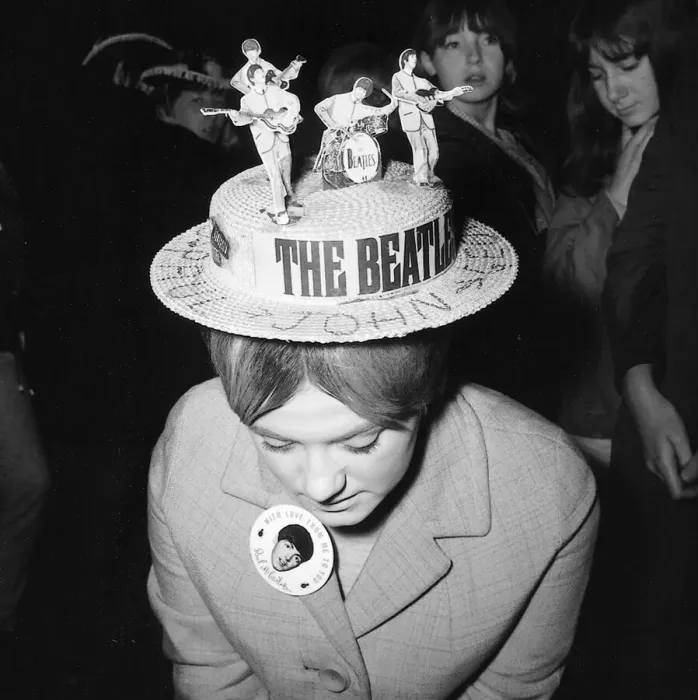 Framed Print : A female fan of the Beatles pop group wearing a hat with a cut out of the Beatles on top Framed Print : A female fan of the Beatles pop group wearing a hat with a cut out of the Beatles on top