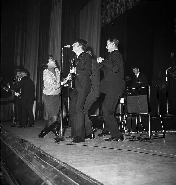 A female fans gets onto the stage with The Beatles at Stockton. 22nd November 1963