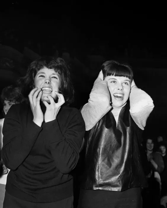 Framed Print : Two female fans watching The Beatles play at Manchester. 20th November 1963 Framed Print : Two female fans watching The Beatles play at Manchester. 20th November 1963