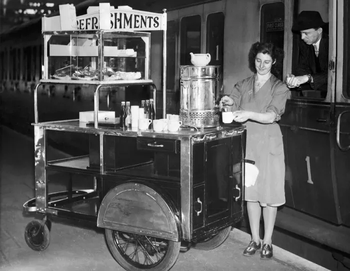 Framed Print : A female worker at Snow Hill Railway station in Birmingham serves a cup of tea from her Framed Print : A female worker at Snow Hill Railway station in Birmingham serves a cup of tea from her