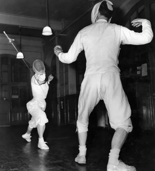 Framed Print : Fencing coaching: Muriel Bridges a coach overreaches with her lunge and is disarmed by Dr Framed Print : Fencing coaching: Muriel Bridges a coach overreaches with her lunge and is disarmed by Dr