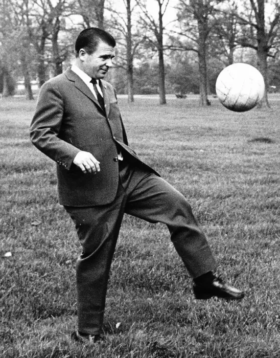 Framed Print : Ferenc Puskas of Real Madrid football club kicking ball in Kensington